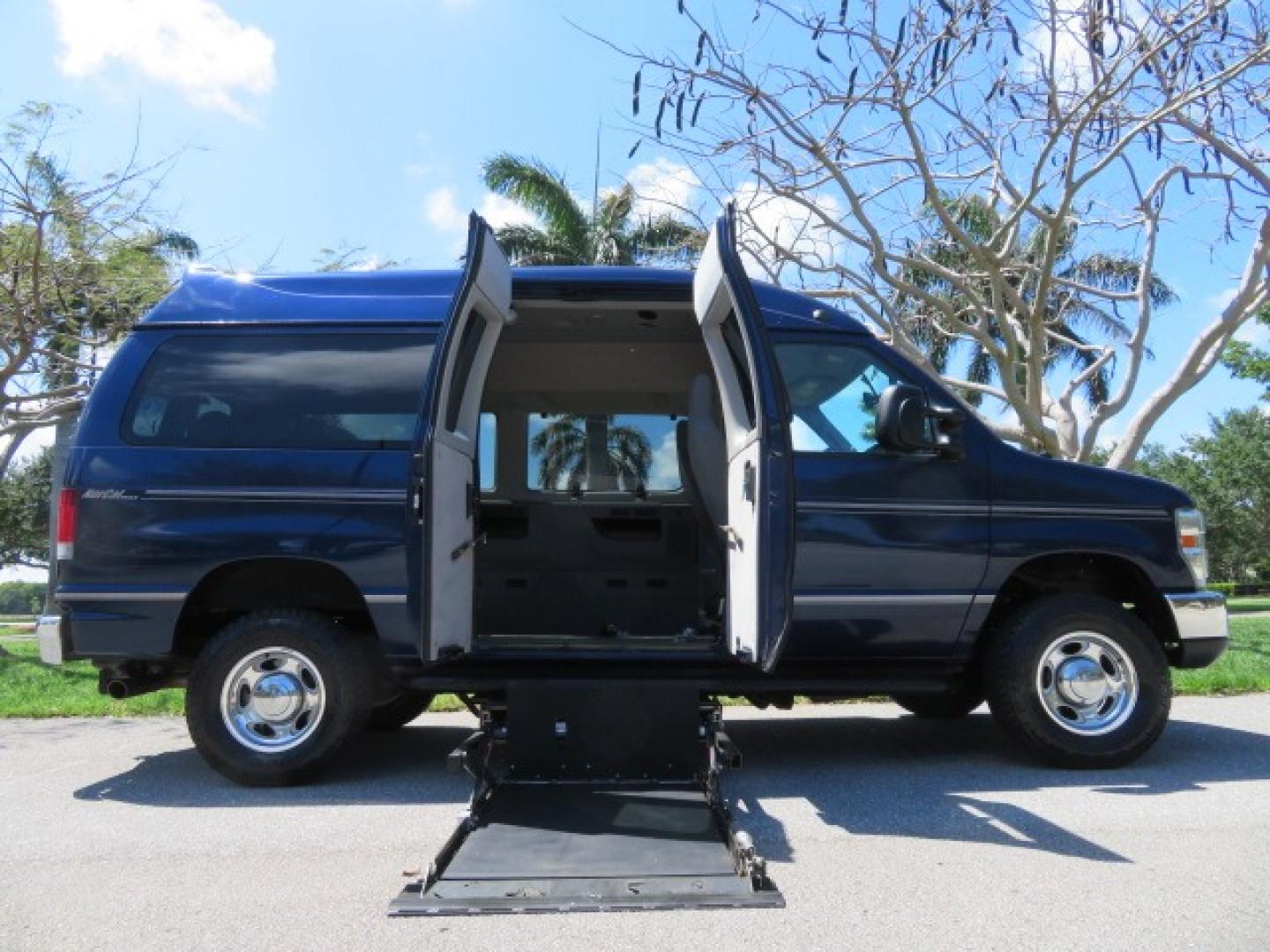 2011 Dark Blue /Gray Ford E-Series Wagon E-350 XLT Super Duty (1FBNE3BS4BD) with an 6.8L V10 SOHC 20V engine, located at 4301 Oak Circle #19, Boca Raton, FL, 33431, (954) 561-2499, 26.388861, -80.084038 - You are looking at a Gorgeous 2011 Ford Econoline E350 XLT Norcal Max High Top Handicap Wheelchair Conversion Van with 6.8L V10, 15K Original Miles, 9 Inch Lowered Floor, Braun UVL Side Entry Wheelchair Lift, Remote Control Power Side Entry Doors, Expanded Side Entry Doors, Q Straint Tie Down, Syste - Photo#42